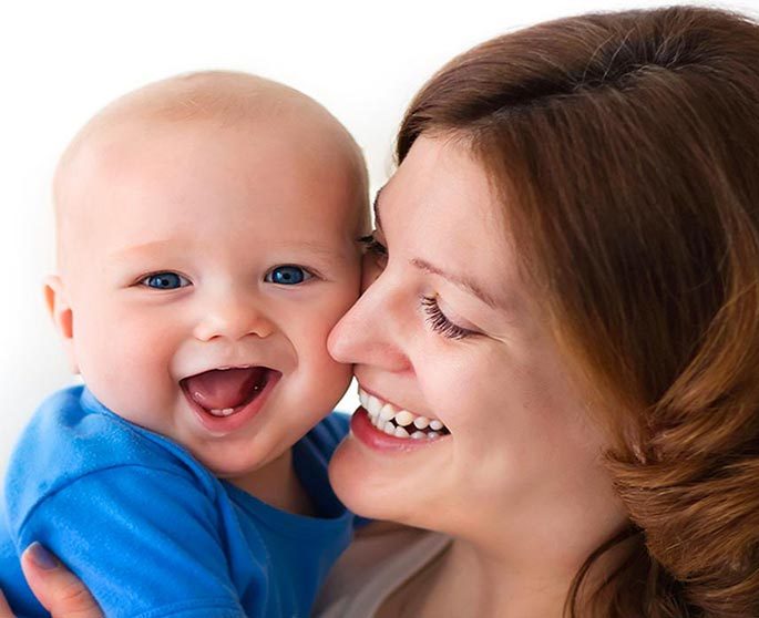 Mother breastfeeding her baby during a consultation